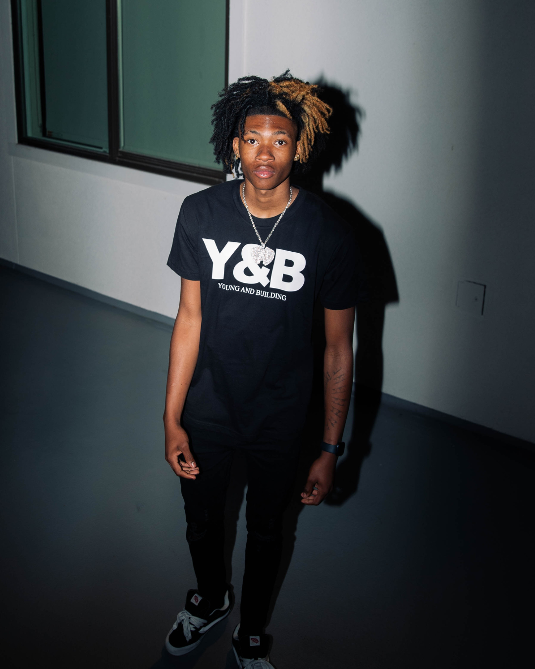 Discover elevated comfort and style with the YNG & BLDN ARCH Premium Tees / T-shirts by Young and Building. Elevate your wardrobe with this high-quality, fashion-forward piece designed for the modern hustler. Upgrade your fashion game with the premium shirts in our traditional black and white colorways