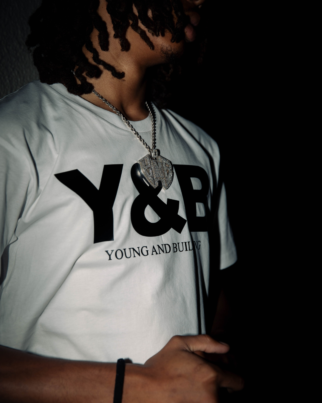 Discover elevated comfort and style with the YNG & BLDN ARCH Premium Tees / T-shirts by Young and Building. Elevate your wardrobe with this high-quality, fashion-forward piece designed for the modern hustler. Upgrade your fashion game with the premium shirts in our traditional black and white colorways